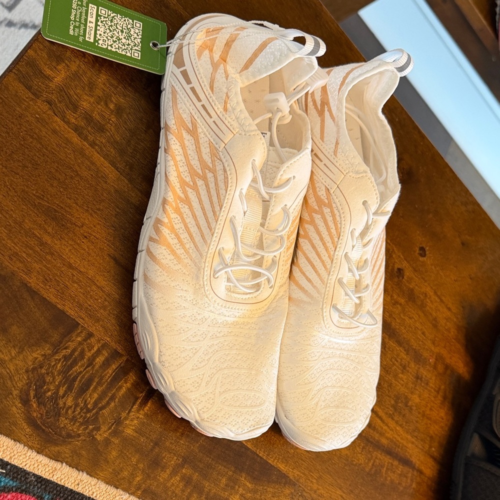 White and Orange Athletic Shoes